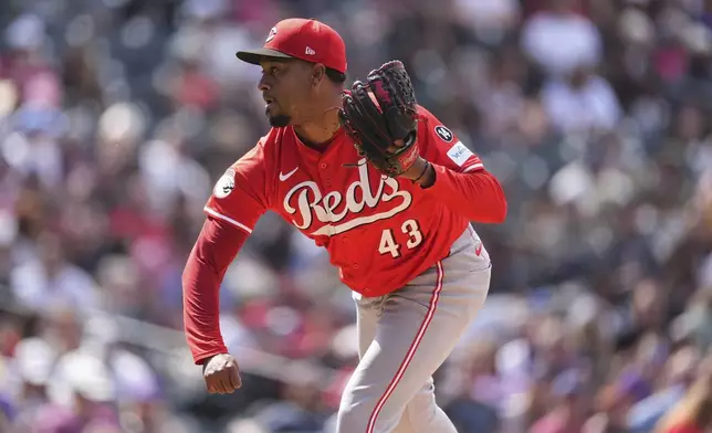 Cincinnati Reds relief pitcher Alexis Díaz works against the Colorado Rockies in the eighth inning of a baseball game Saturday, April 26, 2025, in Denver. (AP Photo/David Zalubowski)