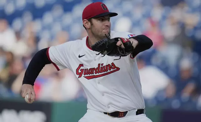 Cleveland Guardians' Gavin Williams pitches in the first inning of a baseball game against the Minnesota Twins in Cleveland, Monday, April 28, 2025. (AP Photo/Sue Ogrocki)