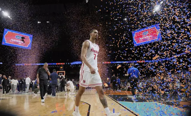 Houston's Milos Uzan (7) leaves the court after Florida beat Houston in the national championship at the Final Four of the NCAA college basketball tournament, Monday, April 7, 2025, in San Antonio. (AP Photo/Eric Gay)
