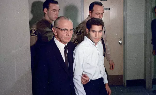FILE - Sirhan Sirhan, right, accused of assassinating Sen. Robert F. Kennedy, is seen with his attorney Russell E. Parsons in Los Angeles in June 1968. (AP Photo, File)