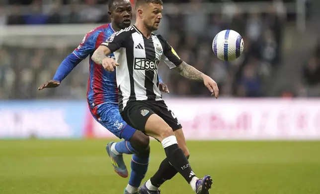 Crystal Palace's Tyrick Mitchell, left, and Newcastle United's Kieran Trippier battle for the ball during the English Premier League soccer match between Newcastle United and Crystal Palace at St. James' Park, Newcastle upon Tyne, England, Wednesday, April 16, 2025. (Owen Humphreys/PA via AP)