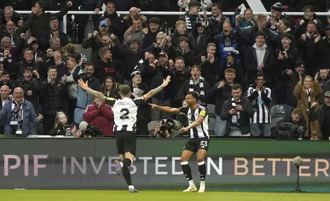 Newcastle United's Jacob Murphy, right, celebrates scoring their side's first goal of the game during the English Premier League soccer match between Newcastle United and Crystal Palace at St. James' Park, Newcastle upon Tyne, England, Wednesday, April 16, 2025. (Owen Humphreys/PA via AP)