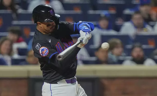 New York Mets' Mark Vientos hits a home run during the sixth inning of a baseball game against the St. Louis Cardinals Friday, April 18, 2025, in New York. (AP Photo/Frank Franklin II)