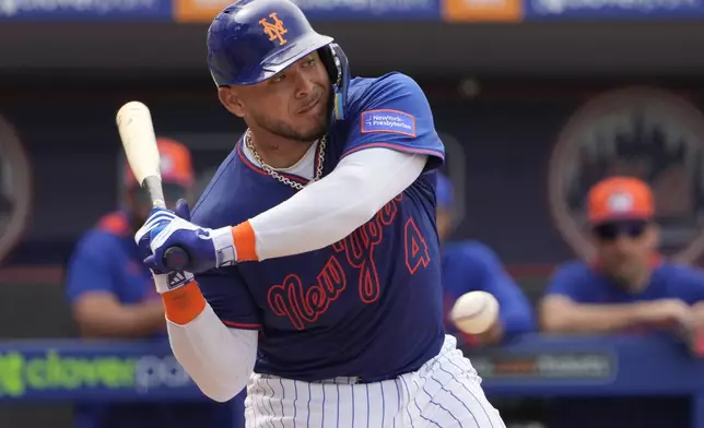 FILE - New York Mets' Francisco Alvarez takes a ball during the fourth inning of a spring training baseball game against the Houston Astros Thursday, Feb. 27, 2025, in Port St. Lucie, Fla. (AP Photo/Jeff Roberson,File)