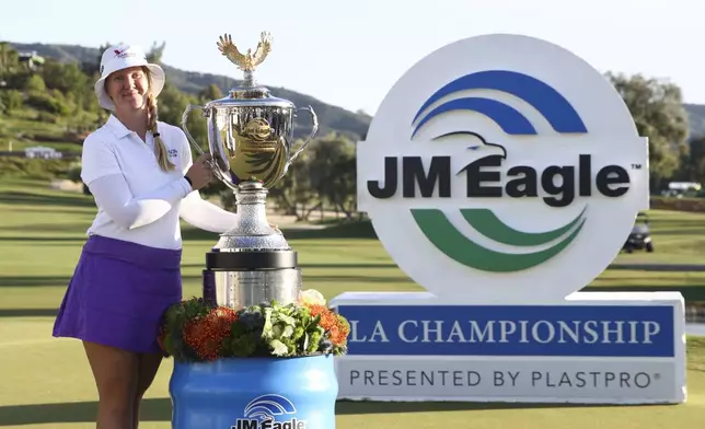 Ingrid Lindblad poses with the trophy after winning the LPGA JM Eagle LA Championship golf tournament at El Caballero Country Club, Sunday, April 20, 2025, in Los Angeles. (AP Photo/Jessie Alcheh)