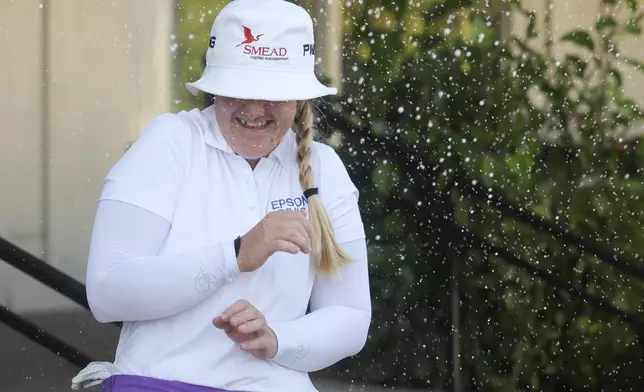 Ingrid Lindblad reacts while being sprayed with champagne after winning the LPGA JM Eagle LA Championship golf tournament at El Caballero Country Club, Sunday, April 20, 2025, in Los Angeles. (AP Photo/Jessie Alcheh)