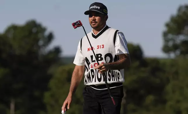 Jason Day, of Australia, waves after making a putt on the 18th hole during the weather delayed first round round at the Masters golf tournament at Augusta National Golf Club, April 12, 2024, in Augusta, Ga. (AP Photo/George Walker IV, file)