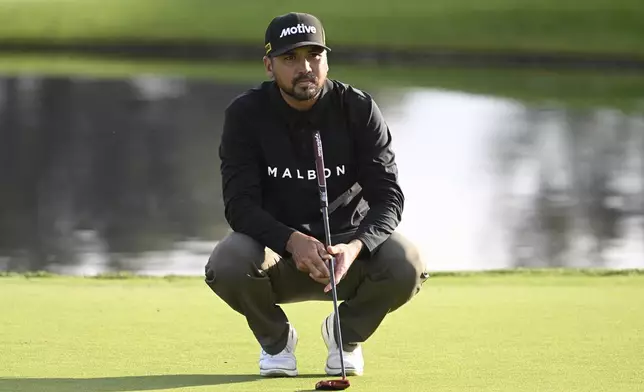 FILE - Jason Day lines up a putt on the 18th hole of the South Course at Torrey Pines during the first round of the Farmers Insurance Open golf tournament, Jan. 22, 2025, in San Diego. (AP Photo/Denis Poroy, file)