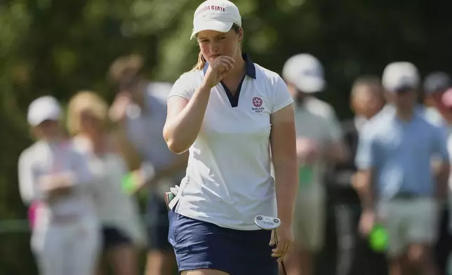Lottie Woad, of England, follows her shot on the fourth green during the final round of the Augusta National Women's Amateur golf tournament, Saturday, April 5, 2025, in Augusta, Ga. (AP Photo/Matt York)