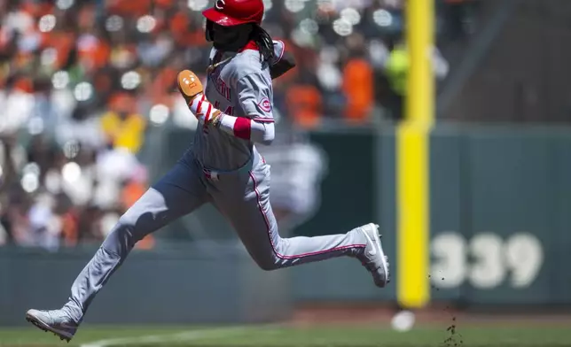 Cincinnati Reds' Elly De La Cruz rounds third base to score during the third inning of a baseball game against the San Francisco Giants in San Francisco, Wednesday, April 9, 2025. (AP Photo/Nic Coury)