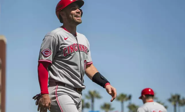 Cincinnati Reds' Austin Wynns celebrates after scoring during the third inning of a baseball game against the San Francisco Giants in San Francisco, Wednesday, April 9, 2025. (AP Photo/Nic Coury)