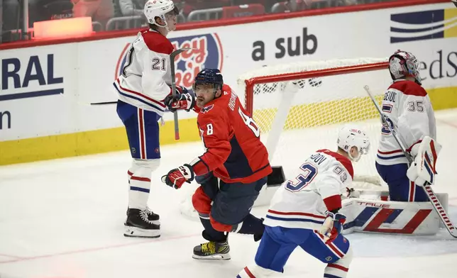 Washington Capitals left wing Alex Ovechkin (8) celebrates after his winning goal past Montreal Canadiens goaltender Sam Montembeault (35) in overtime of Game 1 of a first-round NHL hockey playoff series Monday, April 21, 2025, in Washington. (AP Photo/Nick Wass)