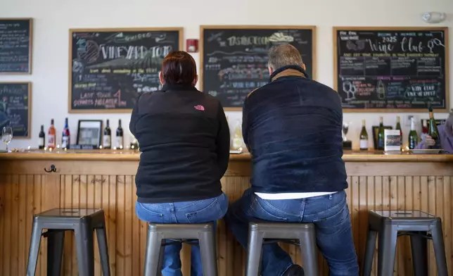 Rose and Paul Wells taste wine at Fox Run Vineyards, Saturday, March 22, 2025, in Penn Yan, N.Y. (Natasha Kaiser via AP)
