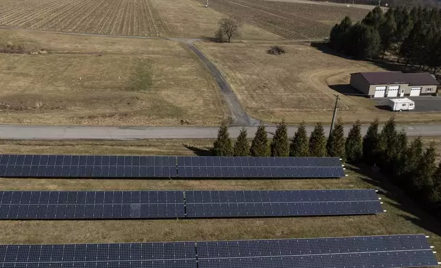 Solar panels operate at Fox Run Vineyards and Seneca Lake, Friday, March 21, 2025, in Penn Yan, N.Y. (Natasha Kaiser via AP)