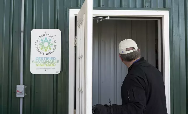 Scott Osborn, owner of Fox Run Vineyards, enters a wine production building Friday, March 21, 2025, in Penn Yan, N.Y. (Natasha Kaiser via AP)
