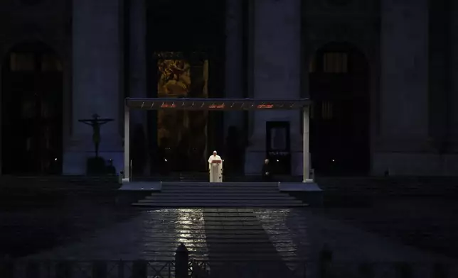 FILE - Pope Francis delivers the Urbi and Orbi prayer (Latin for To the City and To the World) in an empty St. Peter's Square due to the coronavirus pandemic, at the Vatican, Friday, March 27, 2020. (AP Photo/Alessandra Tarantino, File)