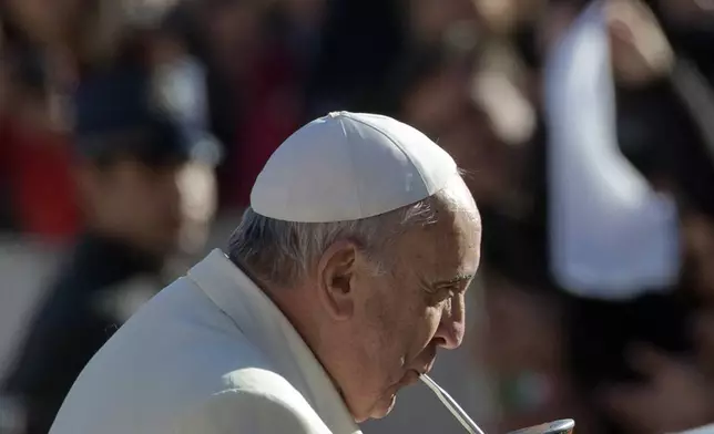 FILE - Pope Francis drinks from a mate gourd, a traditional South American cup, upon his arrival for his weekly general audience in St. Peter's Square at the Vatican, Wednesday, Dec. 17, 2014. (AP Photo/Alessandra Tarantino, file)