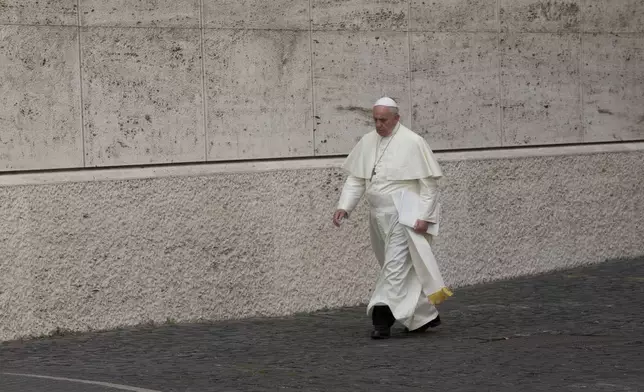 FILE - Pope Francis arrives at the morning session of a two-week synod on family issues, at the Vatican, Thursday, Oct. 16, 2014. (AP Photo/Alessandra Tarantino, file)
