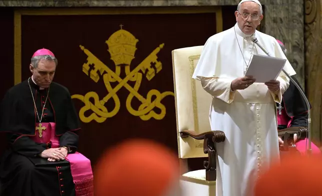 FILE - Pope Francis delivers his message during a meeting with Cardinals and Bishops of the Vatican Curia on the occasion of the exchange of Christmas greetings in the Clementine hall at Vatican, Monday, Dec. 22, 2014. (AP Photo/Andreas Solaro, Pool, File)