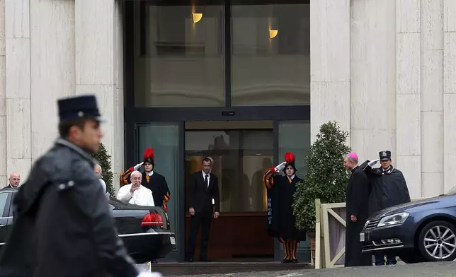 FILE - Pope Francis waves to faithful as he arrives at Vatican's Santa Marta hotel where the Pontiff has his apartment, at the Vatican, March 28, 2013. (AP Photo/Gregorio Borgia, File)