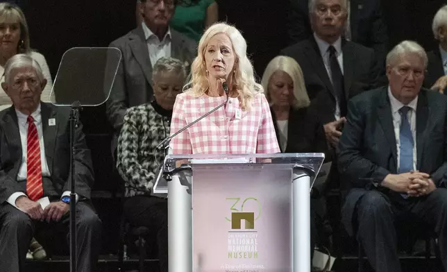 Dr. Susan Chambers welcomes guest, family and friends during the 30th anniversary memorial service for the victims of the 1995 Oklahoma City bombing, in Oklahoma City, Saturday, April 19, 2025. (AP Photo/Alonzo Adams)