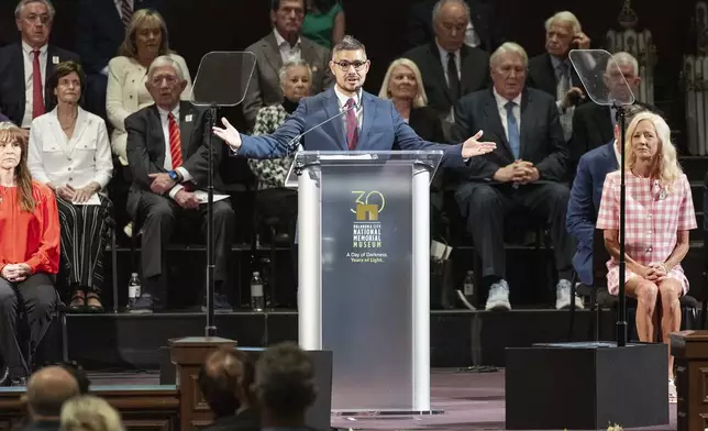 Senior Pastor of First Church Downtown OKC Josue Araujo welcomes guest to his church for the 30th anniversary memorial service for the victims of the 1995 Oklahoma City bombing, in Oklahoma City, Saturday, April 19, 2025. (AP Photo/Alonzo Adams)