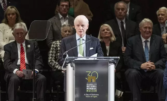 Former Oklahoma Governor Frank Keating speaks to guest during the 30th anniversary memorial service for the victims of the 1995 Oklahoma City bombing, in Oklahoma City, Saturday, April 19, 2025. (AP Photo/Alonzo Adams)