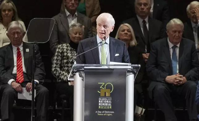 Former Oklahoma Governor Frank Keating speaks to guest during the 30th anniversary memorial service for the victims of the 1995 Oklahoma City bombing, in Oklahoma City, Saturday, April 19, 2025. (AP Photo/Alonzo Adams)