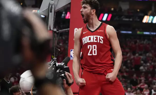 Houston Rockets center Alperen Sengun (28) reacts after he was fouled scoring a basket against the Golden State Warriors during the first half of Game 2 of an NBA basketball first-round playoff series against the Houston Rockets in Houston, Wednesday, April 23, 2025. (AP Photo/Karen Warren)