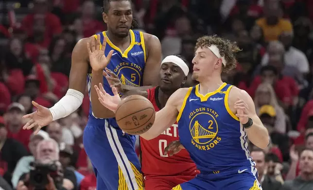 Golden State Warriors guard Brandin Podziemski (2) tries to get control of a ball against Houston Rockets guard Aaron Holiday (0) as Warriors forward Kevon Looney (5) looks on during the first half of Game 2 of an NBA basketball first-round playoff series against the Houston Rockets in Houston, Wednesday, April 23, 2025. (AP Photo/Karen Warren)