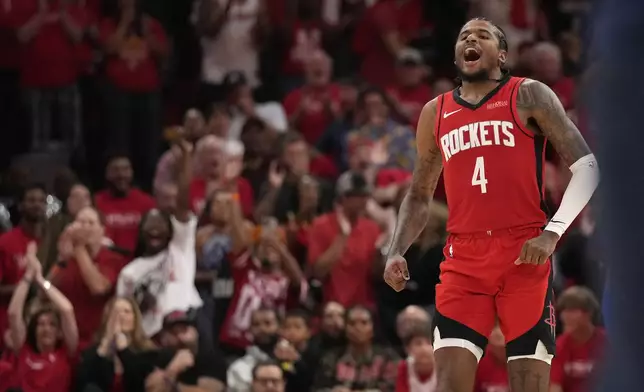Houston Rockets guard Jalen Green (4) reacts after a basket against the Golden State Warriors during the second half of Game 2 of an NBA basketball first-round playoff series against the Houston Rockets in Houston, Wednesday, April 23, 2025. (AP Photo/Karen Warren)