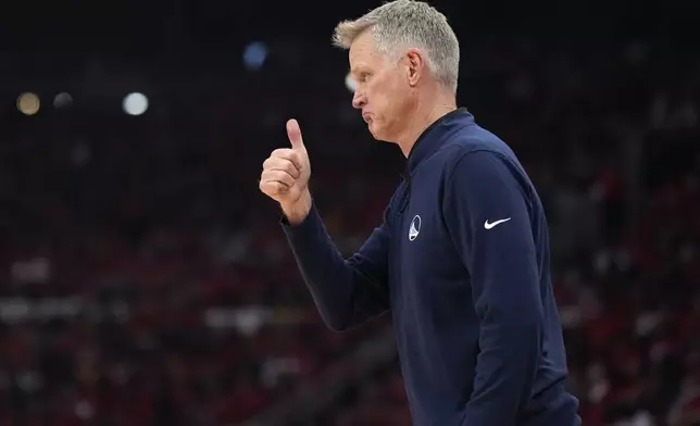 Golden State Warriors head coach Steve Kerr instructs on the sideline during the first half of Game 2 of an NBA basketball first-round playoff series against the Houston Rockets in Houston, Wednesday, April 23, 2025. (AP Photo/Karen Warren)