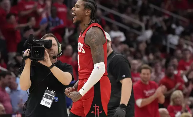 Houston Rockets guard Jalen Green (4) reacts after a basket against the Golden State Warriors during the second half of Game 2 of an NBA basketball first-round playoff series against the Houston Rockets in Houston, Wednesday, April 23, 2025. (AP Photo/Karen Warren)