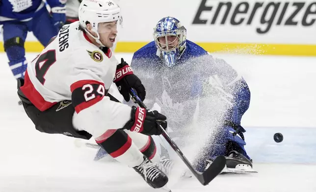 Ottawa Senators' Dylan Cozens (24) scores a short-handed goal against Toronto Maple Leafs goaltender Anthony Stolarz (41) during third period NHL playoff action in Toronto, on Tuesday, April 29, 2025. (Frank Gunn/The Canadian Press via AP)