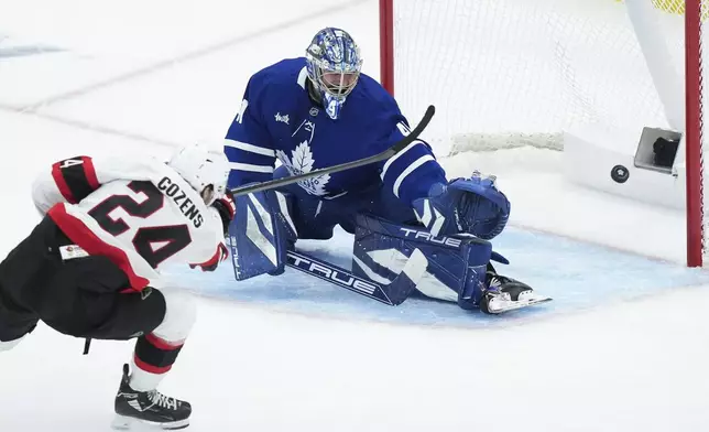 Ottawa Senators' Dylan Cozens (24) scores a short handed goal against Toronto Maple Leafs goaltender Anthony Stolarz (41) during third period NHL playoff action in Toronto on Tuesday, April 29, 2025. (Nathan Denette/The Canadian Press via AP)