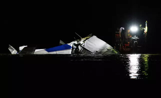 Emergency crews respond after a plane crashed into the Platte River killing several people Friday, April 18, 2025, in Fremont, Neb. (Nikos Frazier/Omaha World-Herald via AP)