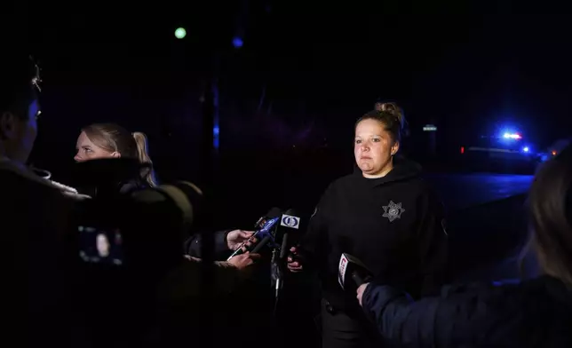 Sgt. Brie Frank, Dodge County Sheriff's Office, speaks to media after a plane crashed into the Platte River killing multiple people Friday, April 18, 2025, in Fremont, Neb. (Nikos Frazier/Omaha World-Herald via AP)