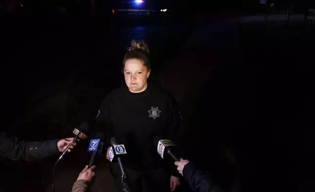 Sgt. Brie Frank, Dodge County Sheriff's Office, speaks to media after a plane crashed into the Platte River killing multiple people Friday, April 18, 2025, in Fremont, Neb. (Nikos Frazier/Omaha World-Herald via AP)