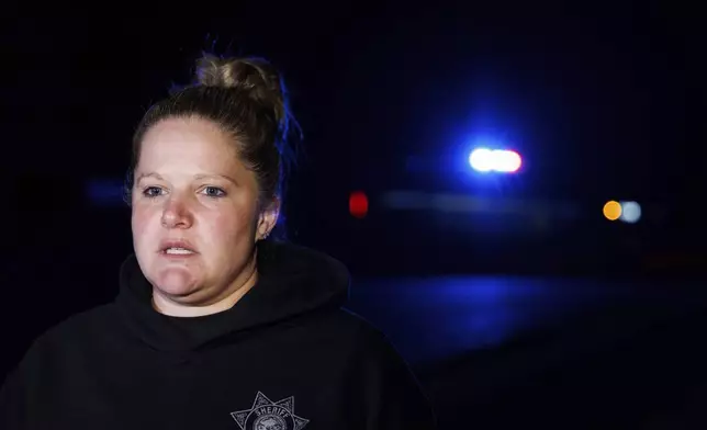 Sgt. Brie Frank, Dodge County Sheriff's Office, speaks to media after a plane crashed into the Platte River killing multiple people Friday, April 18, 2025, in Fremont, Neb. (Nikos Frazier/Omaha World-Herald via AP)