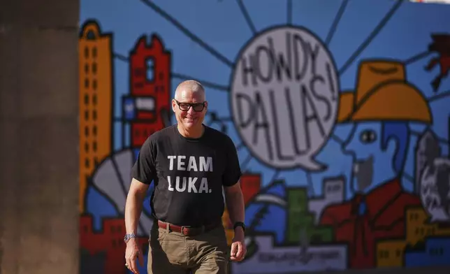 David Welch of Dallas, wears a "Team Luka" shirt as he arrives at the arena for an NBA basketball game between the Los Angeles Lakers and the Dallas Mavericks in Dallas, Wednesday, April 9, 2025. (AP Photo/Julio Cortez)