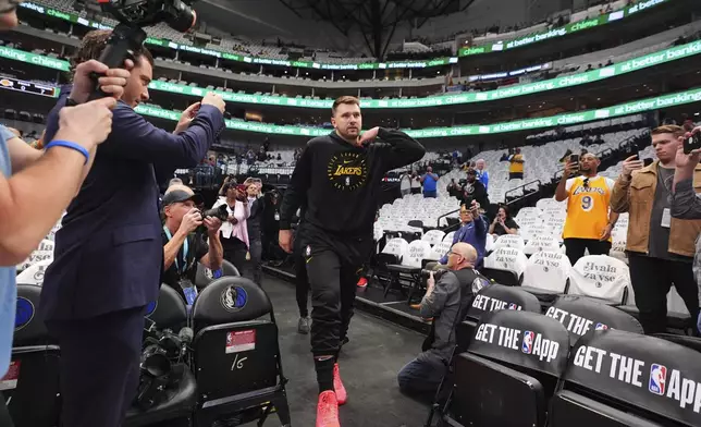 Los Angeles Lakers' Luka Doncic walks onto the court for warmups before an NBA basketball game against the Dallas Mavericks in Dallas, Wednesday, April 9, 2025. (AP Photo/LM Otero)