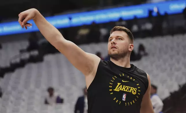 Los Angeles Lakers' Luka Doncic warms up before an NBA basketball game against the Dallas Mavericks in Dallas, Wednesday, April 9, 2025. (AP Photo/LM Otero)