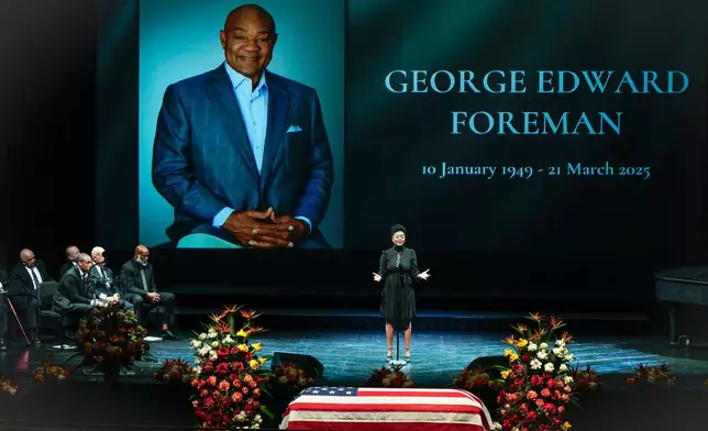 Dana Clark Green sings "Precious Lord" during a memorial service for Olympic and world champion boxer and minister George Foreman at Wortham Theater Center in Houston, Monday, April 14, 2025. (Brett Coomer/Houston Chronicle via AP)