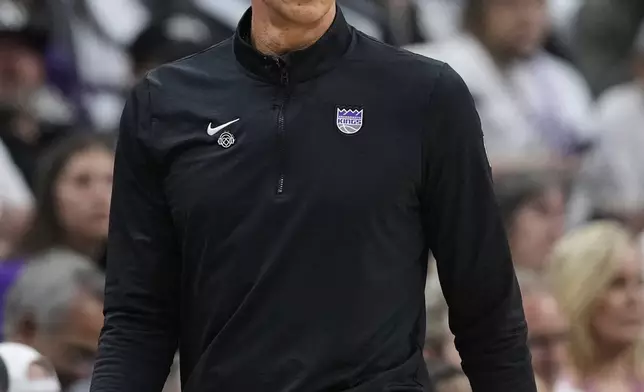 Sacramento Kings interim head coach Doug Christie watches during the first half of an NBA play-in tournament basketball game against the Dallas Mavericks, Wednesday, April 16, 2025, in Sacramento, Calif. (AP Photo/Godofredo A. Vásquez)