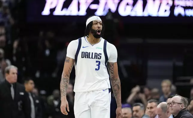 Dallas Mavericks forward Anthony Davis (3) reacts during the first half of an NBA play-in tournament basketball game against the Sacramento Kings, Wednesday, April 16, 2025, in Sacramento, Calif. (AP Photo/Godofredo A. Vásquez)