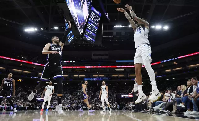 Dallas Mavericks forward P.J. Washington (25) shoots a 3-point basket over Sacramento Kings guard Zach LaVine (8) during the first half of an NBA play-in tournament basketball game Wednesday, April 16, 2025, in Sacramento, Calif. (AP Photo/Godofredo A. Vásquez)