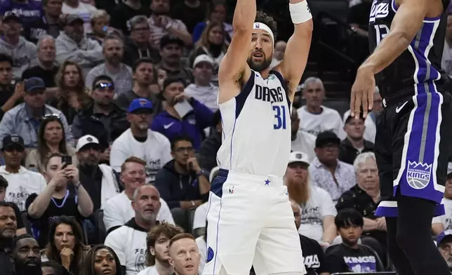 Dallas Mavericks guard Klay Thompson (31) shoots a 3-point basket next to Sacramento Kings forward Keegan Murray (13) during the first half of an NBA play-in tournament basketball game Wednesday, April 16, 2025, in Sacramento, Calif. (AP Photo/Godofredo A. Vásquez)