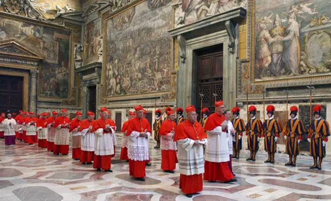 FILE - In this photo from files taken on April 18, 2005 and released by the Vatican paper L'Osservatore Romano, Cardinals walk in procession to the Sistine Chapel at the Vatican, at the beginning of the conclave. (Osservatore Romano via AP, File)
