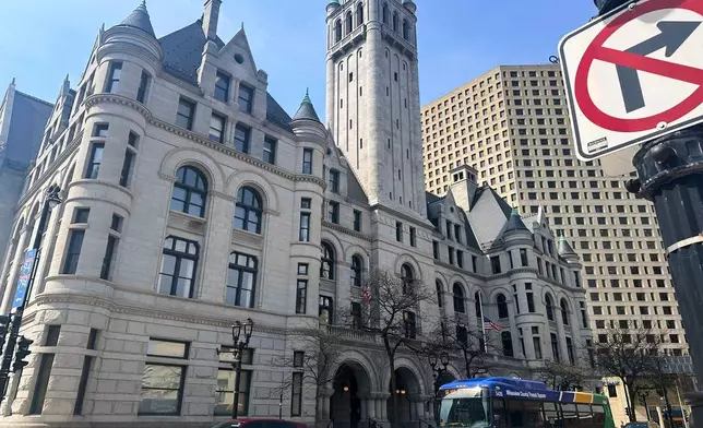 Traffic passes the Federal courthouse in Milwaukee on Friday, April 25, 2025. (AP Photo/Devi Shastri)