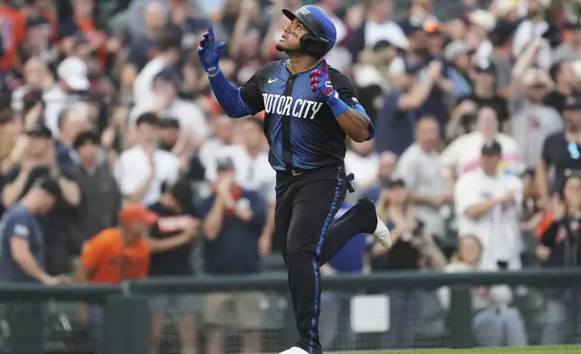 Detroit Tigers' Andy Ibáñez celebrates his home run as he rounds third base against the Kansas City Royals in the fourth inning during a baseball game, Friday, April 18, 2025, in Detroit. (AP Photo/Paul Sancya)